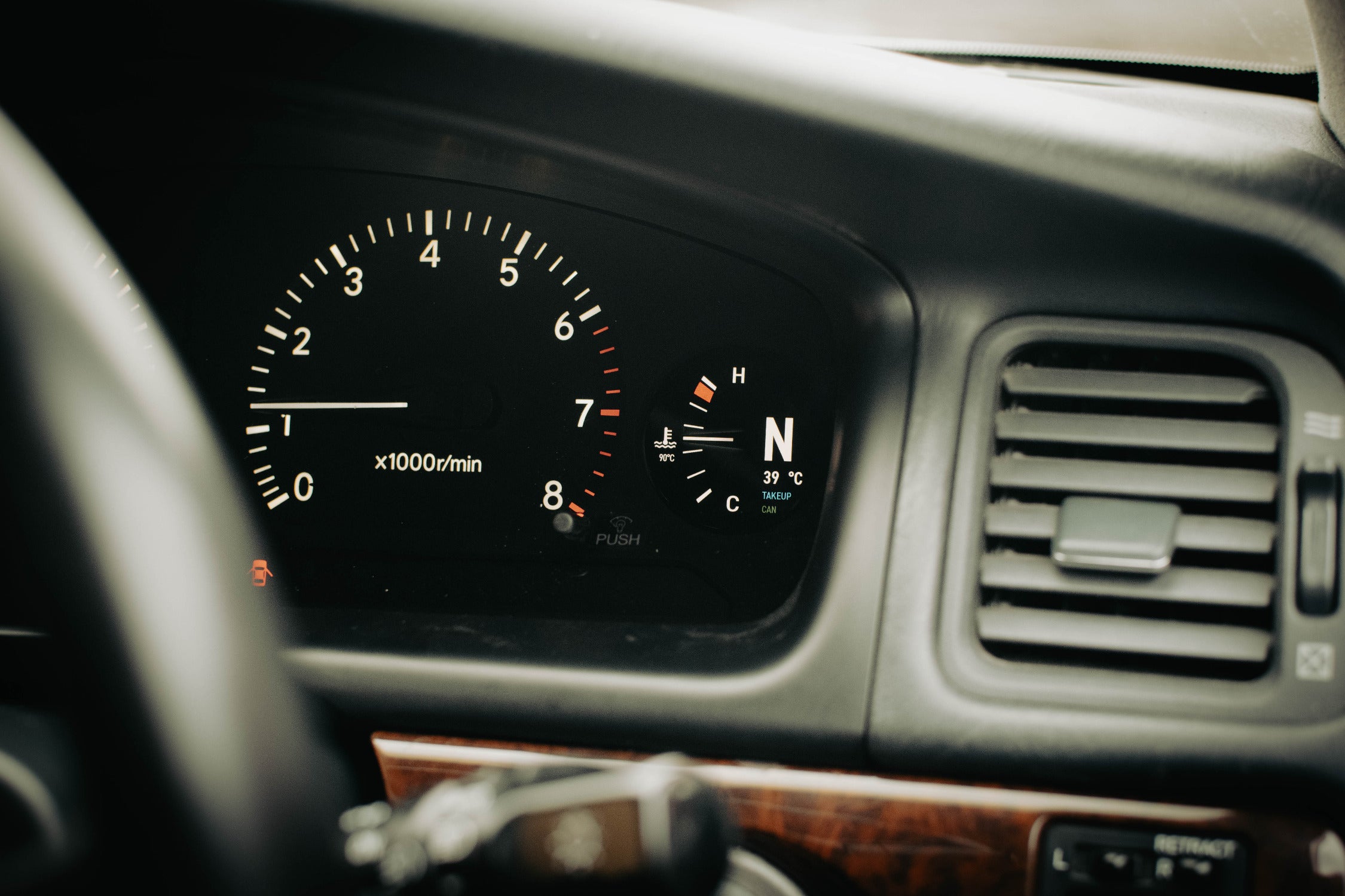Car dashboard with speedometer and other gauges